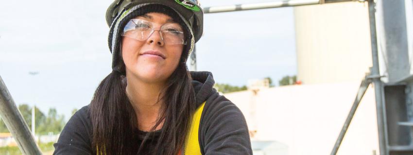 Woman wearing safety glasses and hard hat