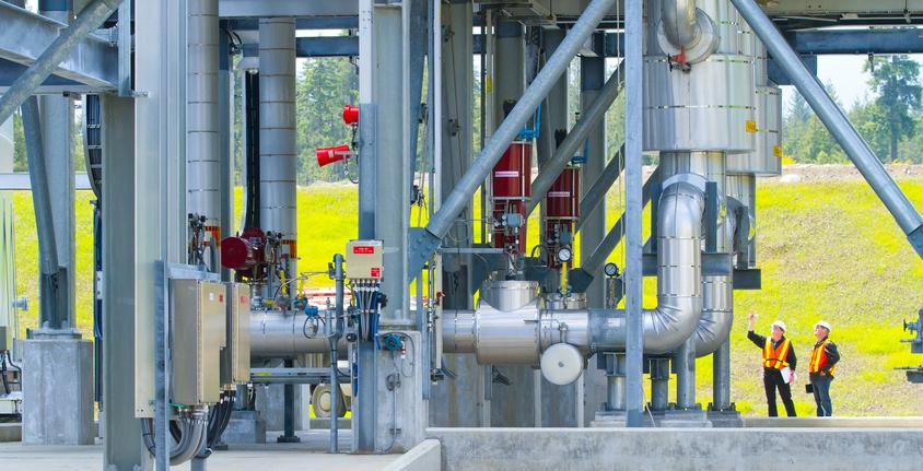 Two people inspecting equipment at Tilbury LNG facility