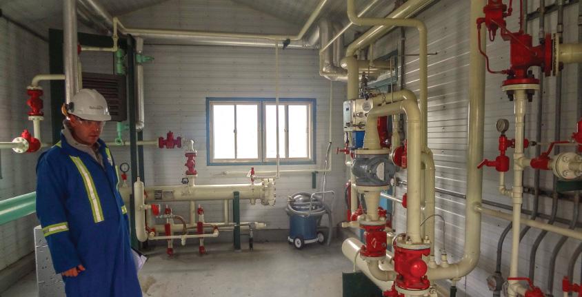 Matt Heemskerk, Manager of Projects, Solaris, conducts a project site inspection at a metering station.
