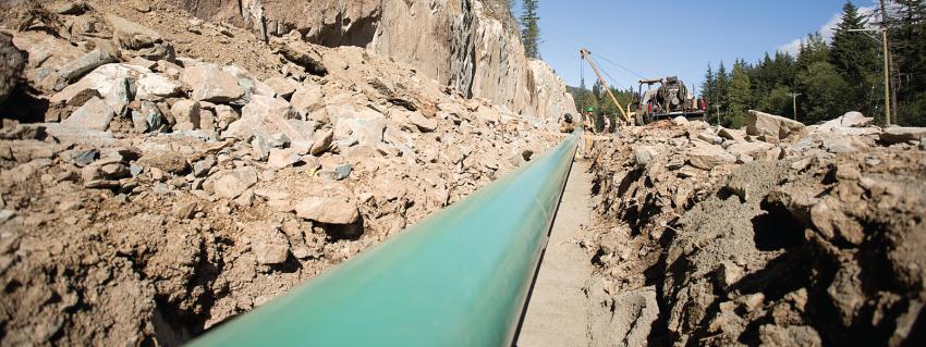 Gas pipeline running along a rocky hillside