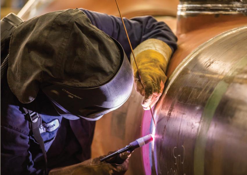 Welder works on gas line