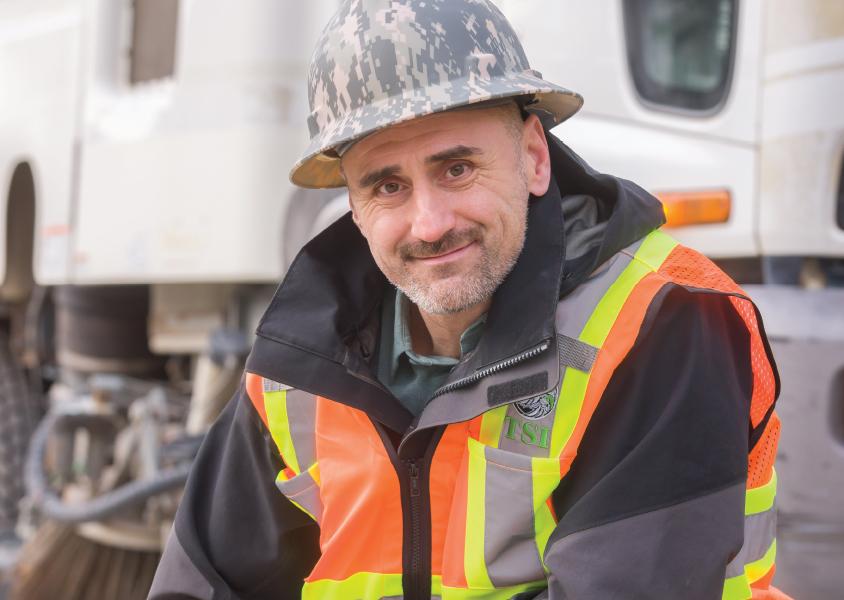 Man wearing hard hat and TSI vest