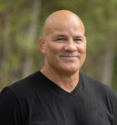 Greg Edgelow smiles at the camera